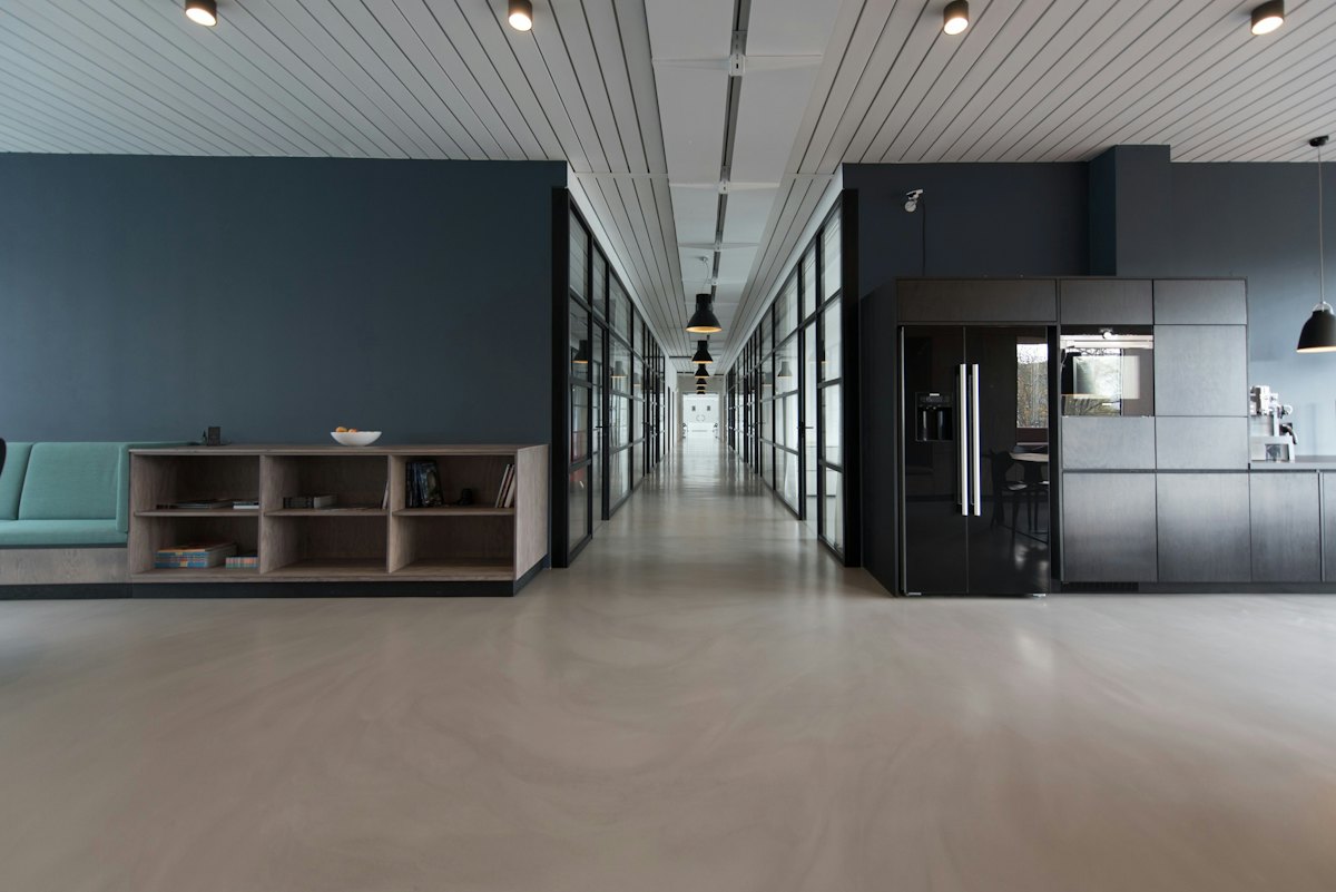A bright, modern office floor for a delivery team.